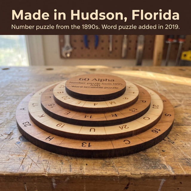 The 60 Alpha puzzle on a worn wooden workbench. Headline: Made in Hudson, Florida. Number puzzle from the 1890s. Word puzzle added in 2019.