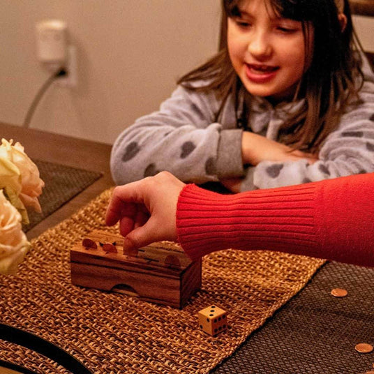 family_playing_penny_drop_game_1 - Creative Crafthouse