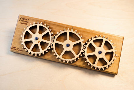 Creative Crafthouse Enigma II Small with three meshed wooden alphabet gears for writing secret messages.