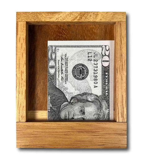 Cash Out puzzle box showing its clear window and included play money