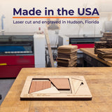 The Cruiser puzzle on a workbench in the Creative Crafthouse laser shop, with the headline Made in the USA, laser cut and engraved in Hudson, Florida.