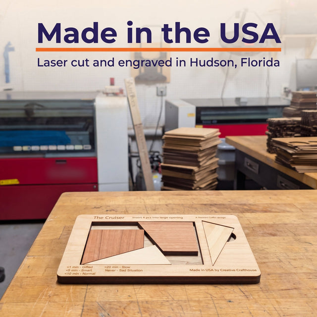 The Cruiser puzzle on a workbench in the Creative Crafthouse laser shop, with the headline Made in the USA, laser cut and engraved in Hudson, Florida.