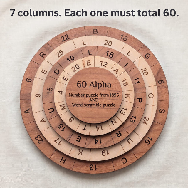 Top view of the 60 Alpha puzzle on linen showing seven columns of numbers and letters across the base and three rings. Headline: 7 columns. Each one must total 60.