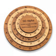 60 Alpha wooden math and word puzzle by Creative Crafthouse on white: an engraved cherry base and three stepped maple and cherry rings around a cherry center cap.