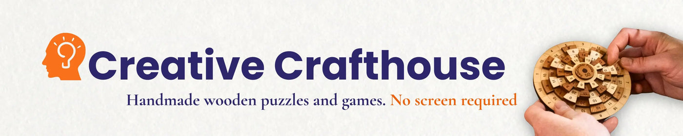 Creative Crafthouse logo with a hand holding a wooden puzzle on a white background