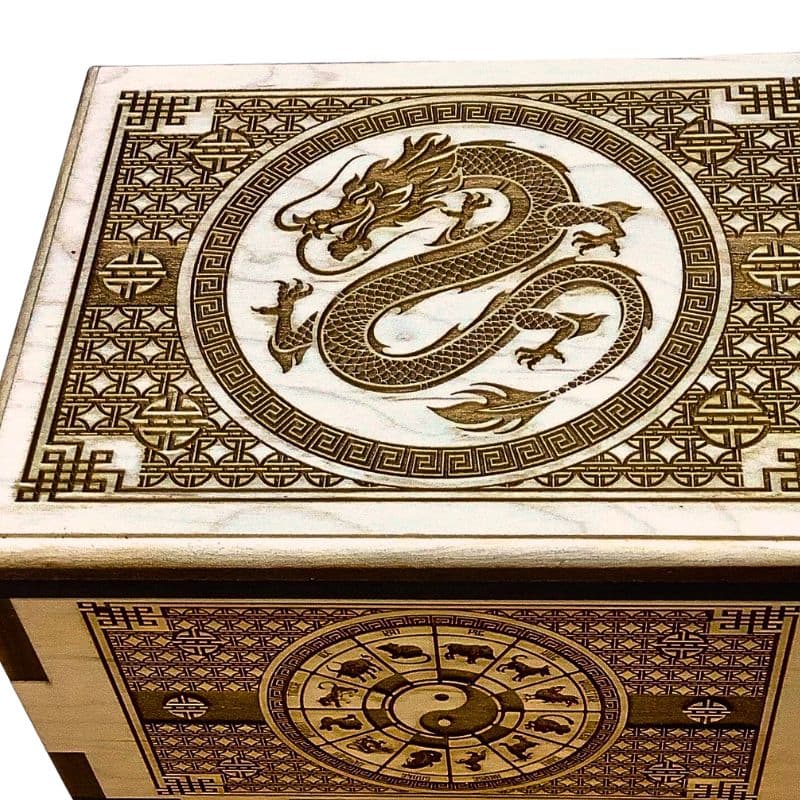 Decorative wooden box showcasing the fine detail and high quality of creative crafthouse's laser engraving service featuring a dragon design and Chinese symbols