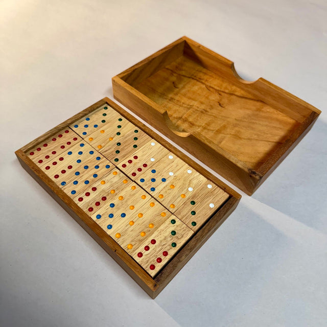 Double 6 wooden dominoes in the open storage box, with the lift-off lid alongside.
