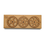 Enigma II Encryption Machine, a working wooden cipher machine by Creative Crafthouse with three rotating laser-engraved alphabet gears for encoding secret messages, shown on a white background.