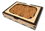 Fisherman's Dilemma puzzle at an angle, showing engraved fish pieces fitted into the rectangular tray.