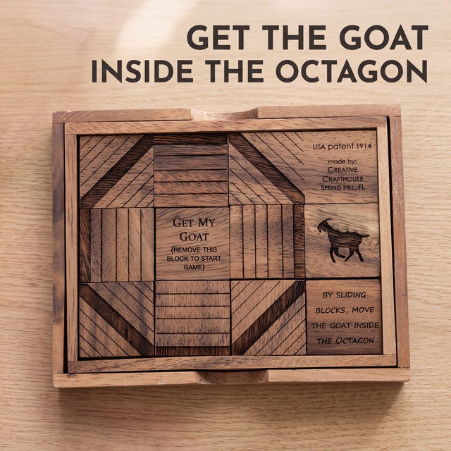 The Get My Goat wooden sliding block puzzle lying flat on a light oak table, its engraved raintree blocks forming the octagon around the title block and the goat. Headline: Get the goat inside the octagon.