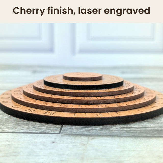 Low side photo of the five stepped cherry-veneer disks of the Mexican Army Cipher Wheel with dark laser-cut edges