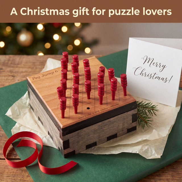 Peg Jump 6 unwrapped as a Christmas gift with green paper, red ribbon, an evergreen sprig and a Merry Christmas card. Headline: A Christmas gift for puzzle lovers.