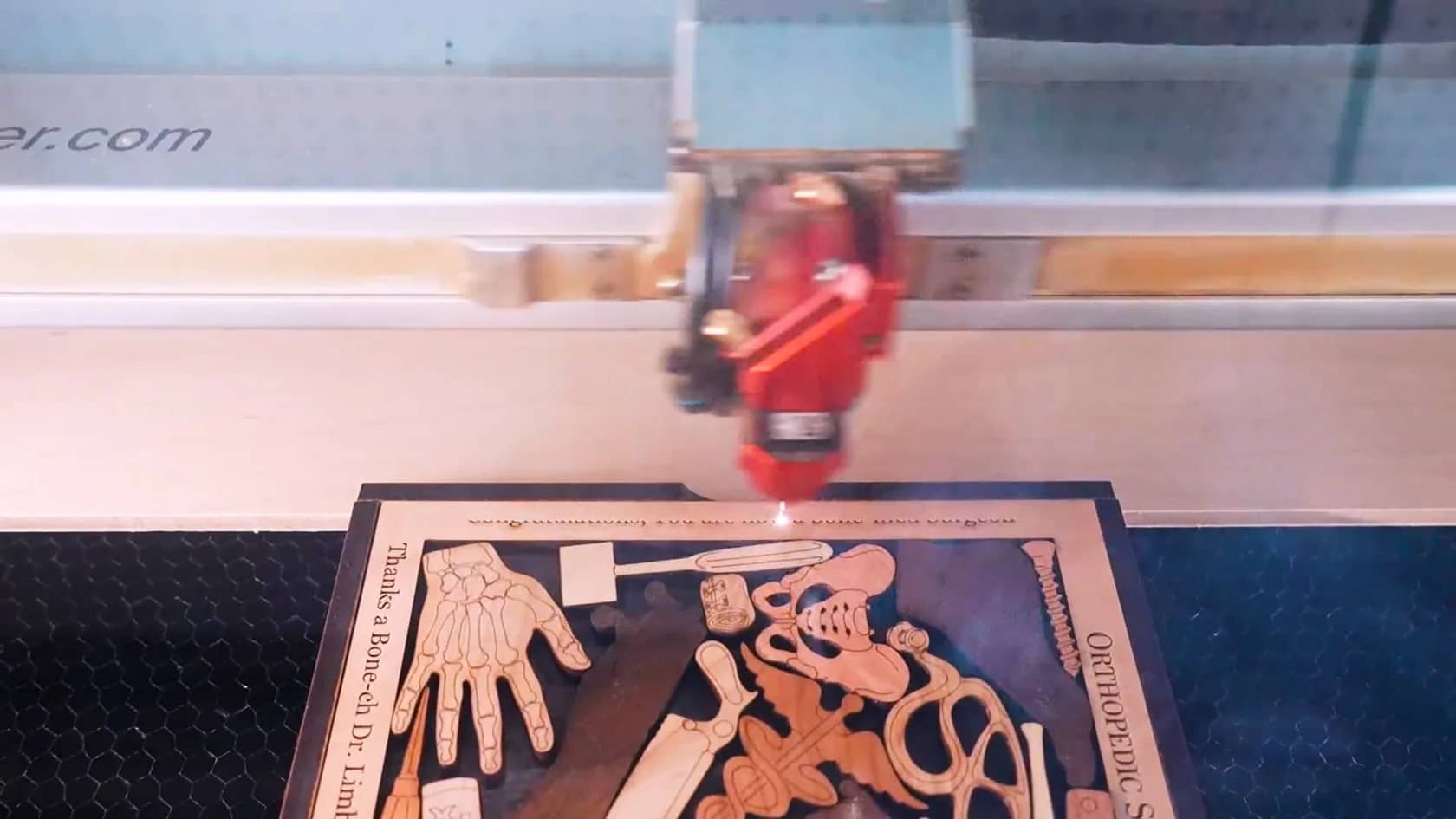Watch Creative Crafthouse laser engrave a message onto a wooden puzzle.