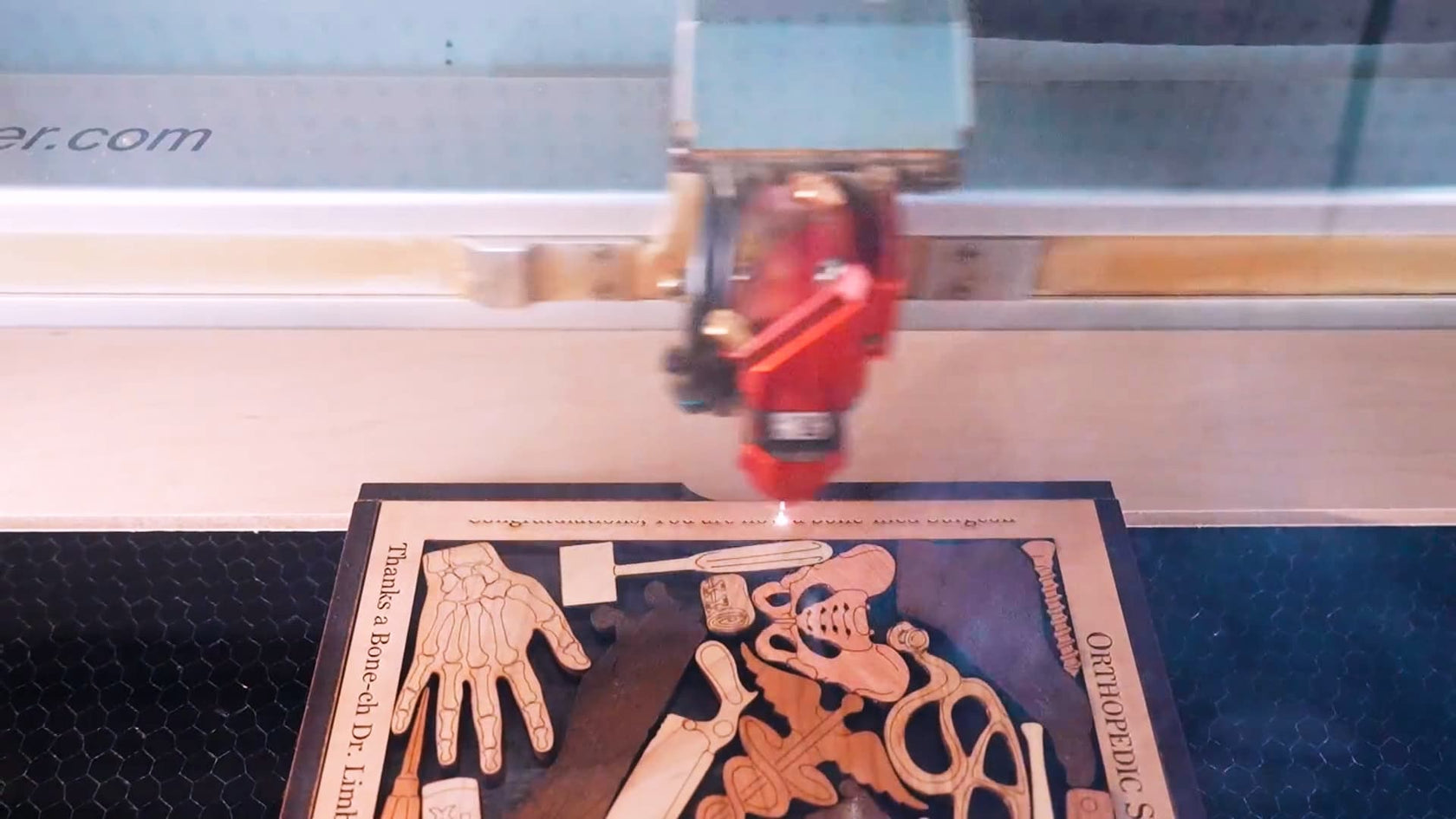 creative crafthouse personalizing a wood brain teaser gift with a custom laser engraving.