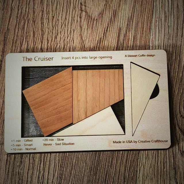 Cruiser Small wooden brain teaser video by Creative Crafthouse: the four Stewart Coffin puzzle pieces placed in the wood tray, with the Hudson, Florida family workshop closing card