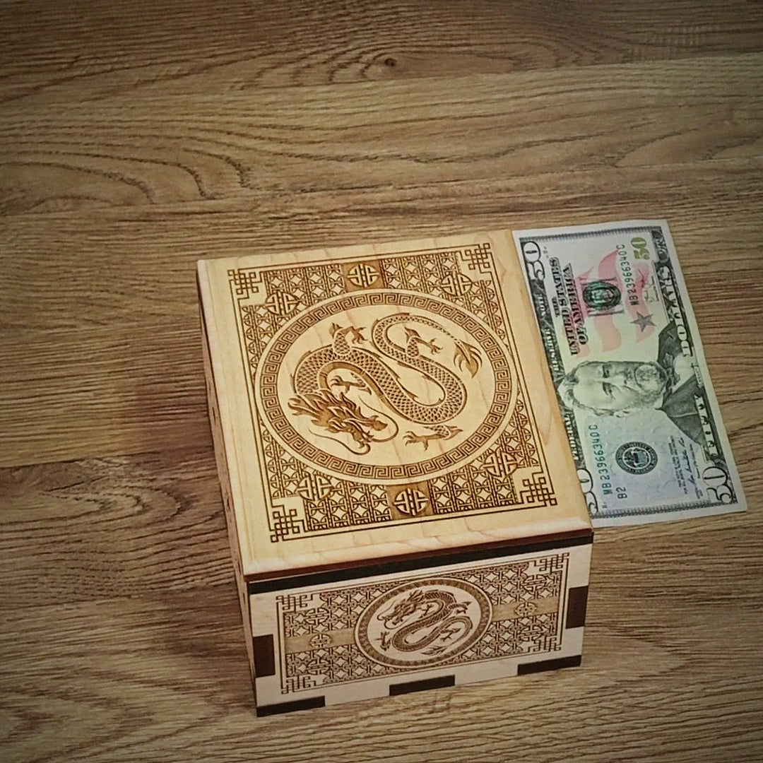 Dragon Hurricane Box video by Creative Crafthouse: hands open the laser-engraved maple puzzle box with Chinese dragon artwork to reveal the hidden compartment, closing with the handmade in Hudson, Florida family card.