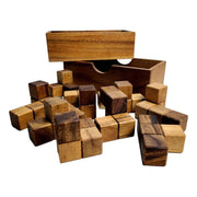 Procrastinator wooden puzzle by Creative Crafthouse, open box with two-tone wood puzzle pieces spilled in front