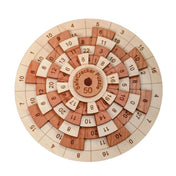 Safecracker 50 wooden math brain teaser by Creative Crafthouse, a Dave Janelle design in laser-cut maple and cherry with five rotating rings of engraved numbers around a SafeCracker Puzzle 50 hub, shot flat on white